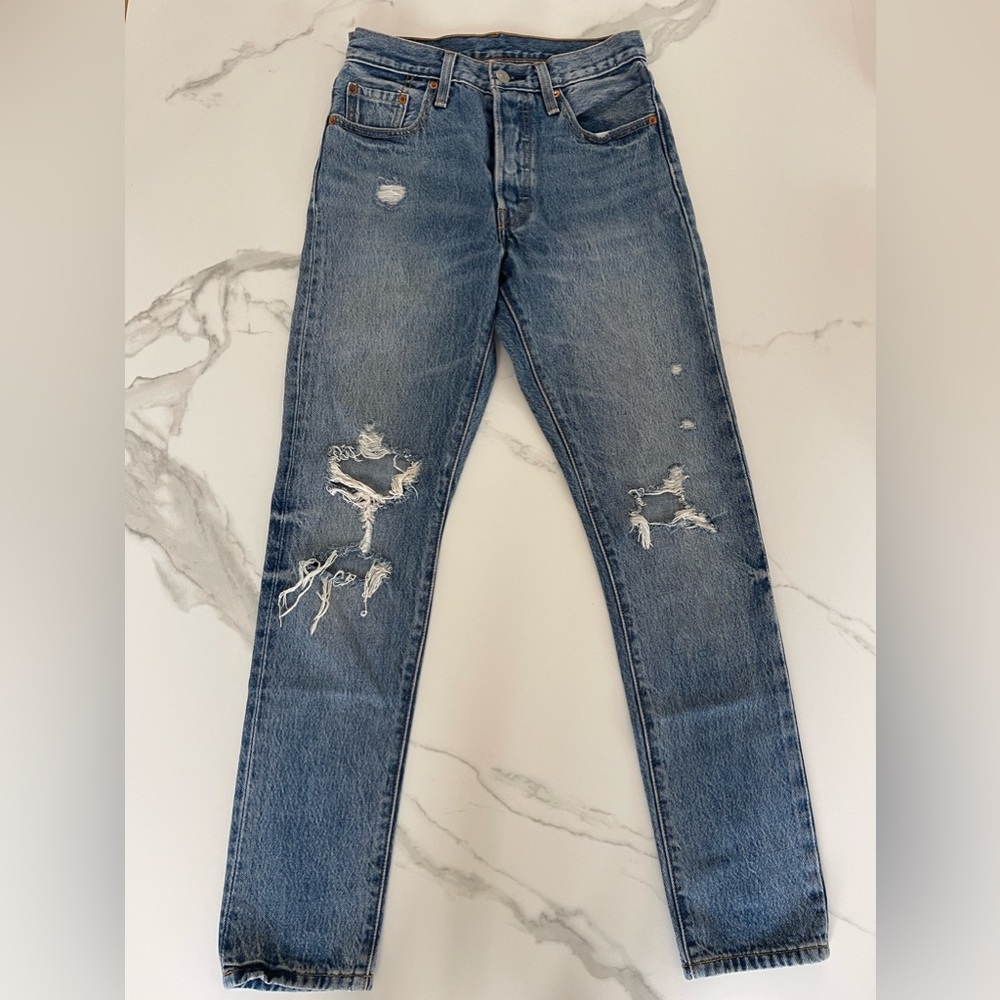 Levi’s 501 High Waisted jeans distresses at the knees